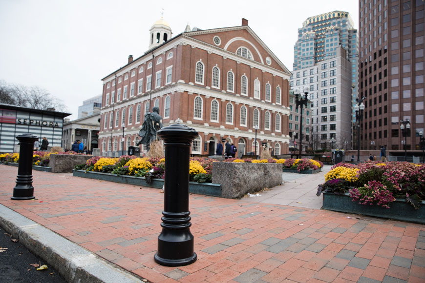 A bollard stands at a crosswalk near the Freedom Trail in Boston