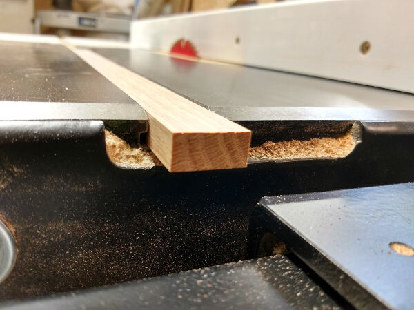 Miter sled hardwood runner in miter slot