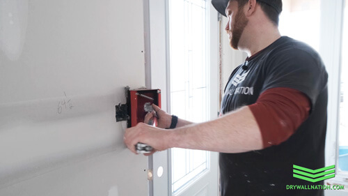 Drywall Nation showing how to use a drywall flat box when finishing wall plugs.