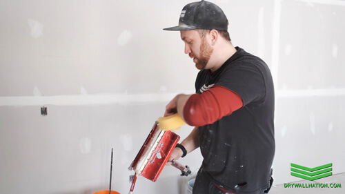 Drywall Nation showing how to keep a drywall flat box clean when finishing wall joints.